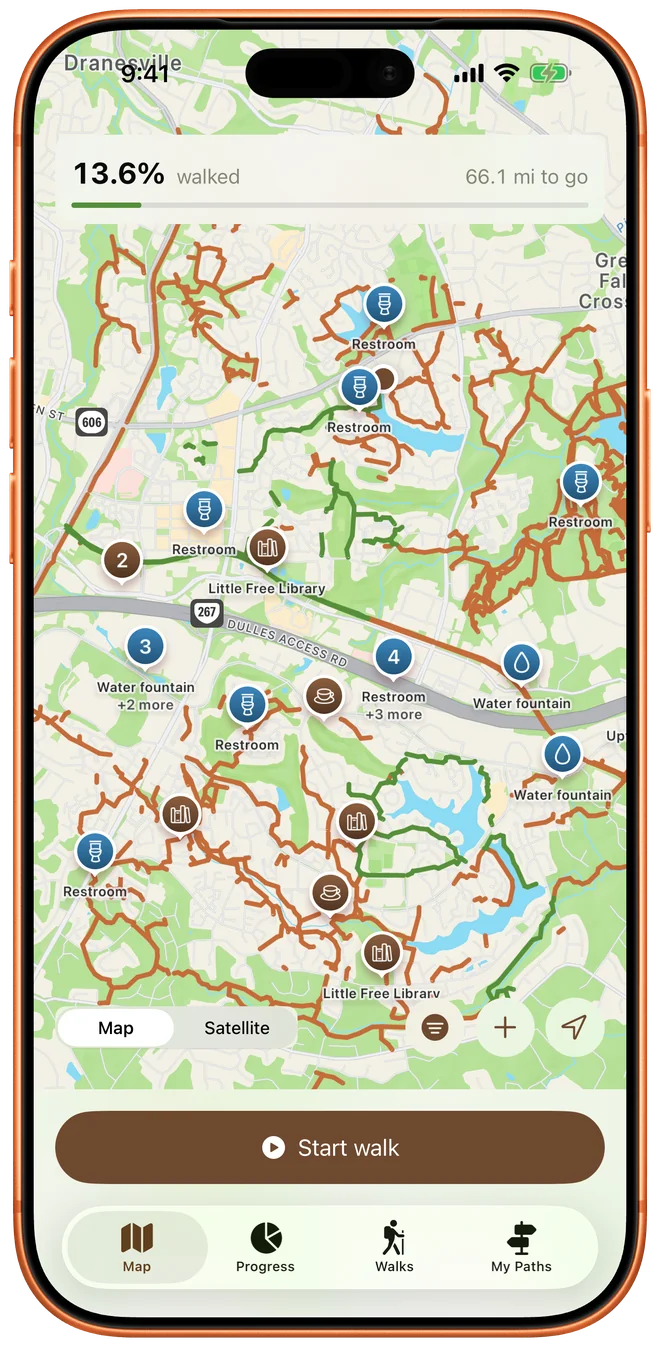 The map, with walked paths in green, the rest in rust orange, and pins for restrooms, fountains and Little Free Libraries